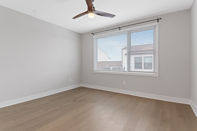 unfurnished room featuring hardwood / wood-style flooring and ceiling fan