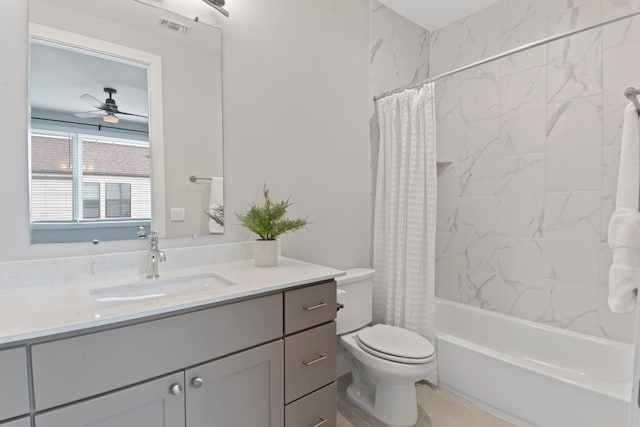 full bathroom with vanity, ceiling fan, toilet, and shower / bath combo