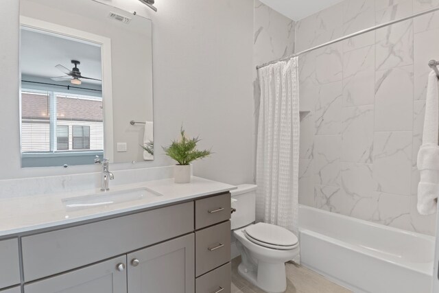 4510 Unity Cir Unit 258, Austin, TX 78731 - full bath featuring vanity, a ceiling fan, toilet, and shower / bath combination with curtain