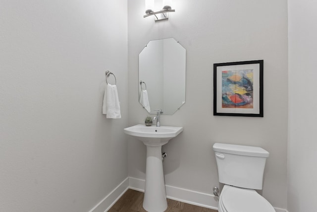 4510 Unity Cir Unit 258, Austin, TX 78731 - half bath with toilet, baseboards, and wood finished floors