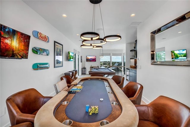 game room with baseboards and recessed lighting