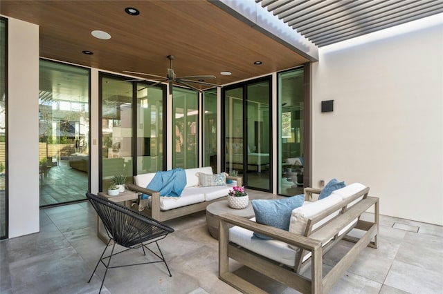 view of patio with ceiling fan and an outdoor hangout area