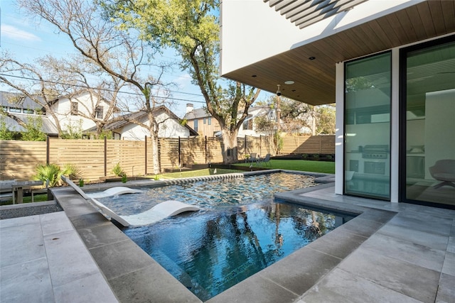 view of swimming pool featuring a patio