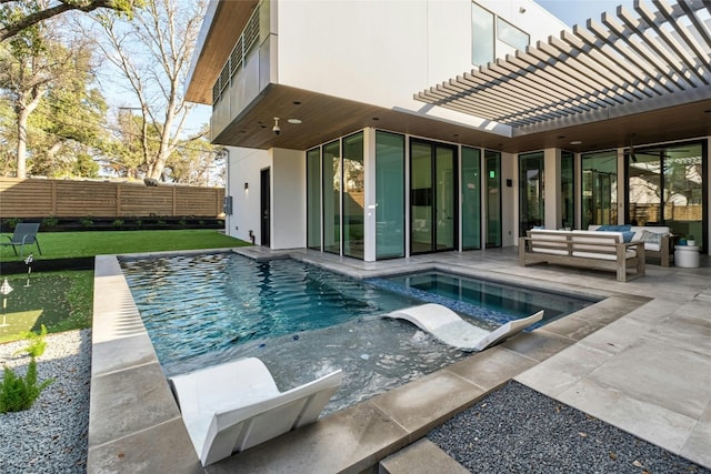 view of pool with a pergola, a patio area, and outdoor lounge area