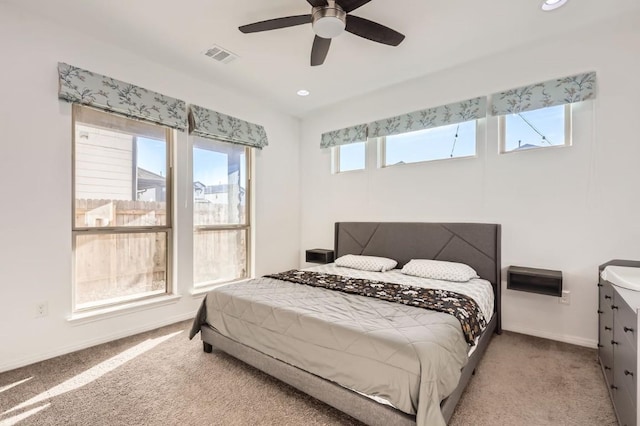 carpeted bedroom featuring ceiling fan