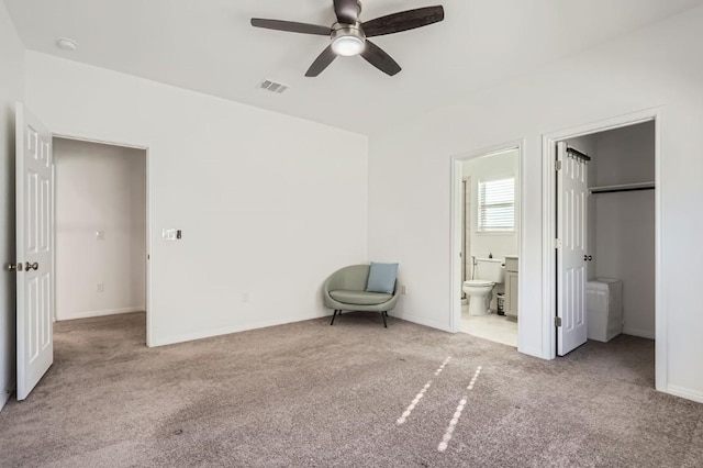205 Audie Murphy Cir, Leander, TX 78641 - unfurnished bedroom with carpet floors, ensuite bathroom, baseboards, and ceiling fan