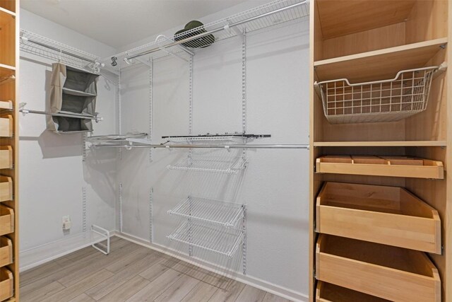 3601 Marcae Ct, Austin, TX 78704 - walk in closet featuring wood finished floors
