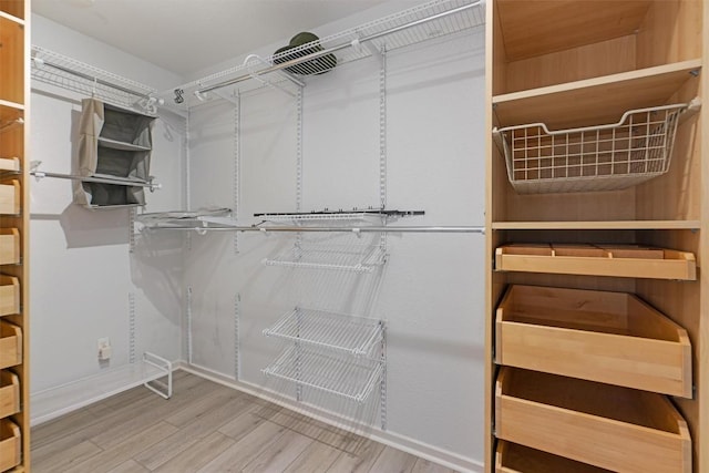 3601 Marcae Ct, Austin, TX 78704 - walk in closet featuring wood finished floors