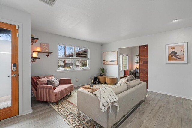 3601 Marcae Ct, Austin, TX 78704 - living room featuring light wood-type flooring and baseboards