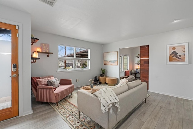 3601 Marcae Ct, Austin, TX 78704 - living room featuring light wood-type flooring and baseboards