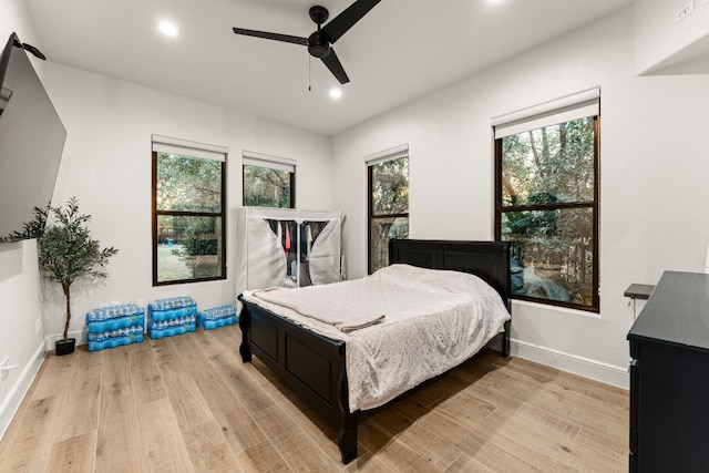 bedroom featuring ceiling fan and light wood-type flooring