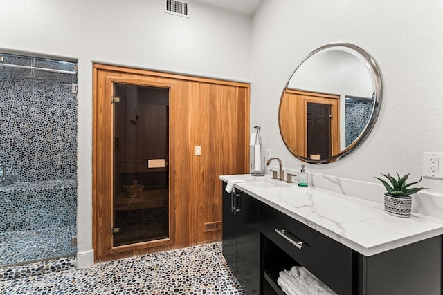 bathroom with vanity and an enclosed shower