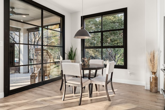 dining space with light wood-type flooring