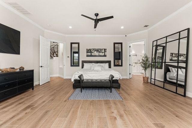 bedroom featuring ensuite bath, ornamental molding, ceiling fan, and light wood-type flooring