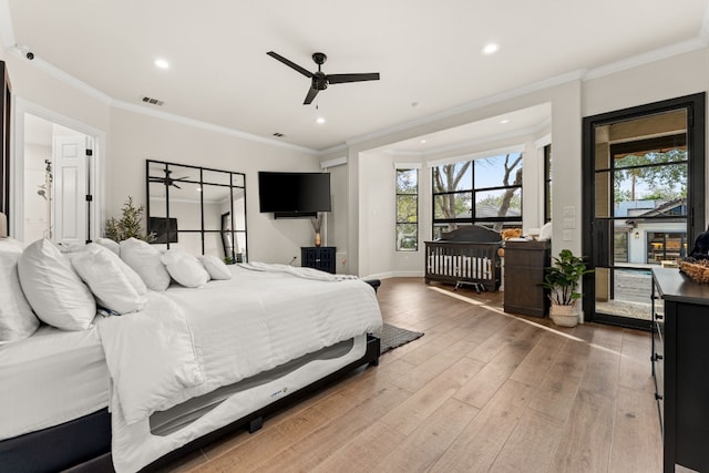 bedroom with hardwood / wood-style flooring, ceiling fan, and ornamental molding