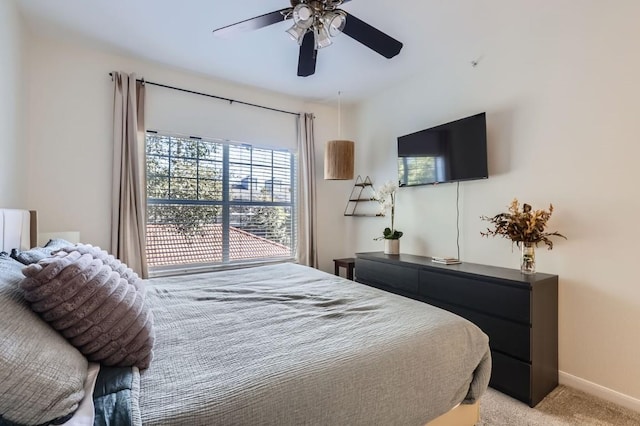 bedroom with light carpet and ceiling fan