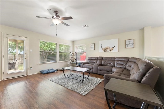 living room with ceiling fan and dark hardwood / wood-style floors