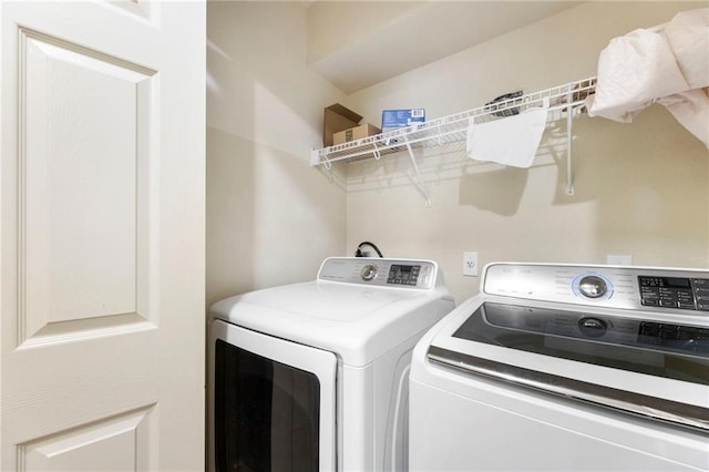 washroom with separate washer and dryer