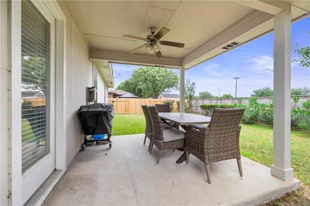 view of patio with area for grilling and ceiling fan