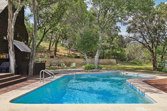 view of swimming pool with a patio area