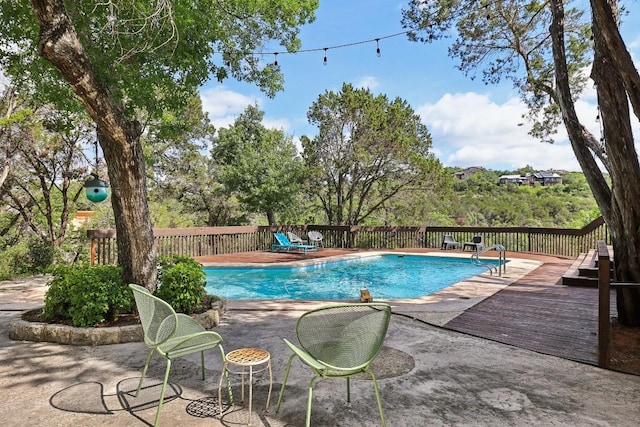 view of pool featuring a wooden deck