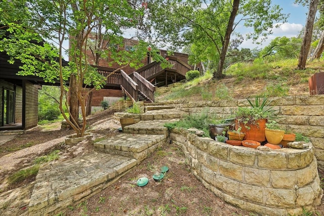 view of yard featuring a wooden deck