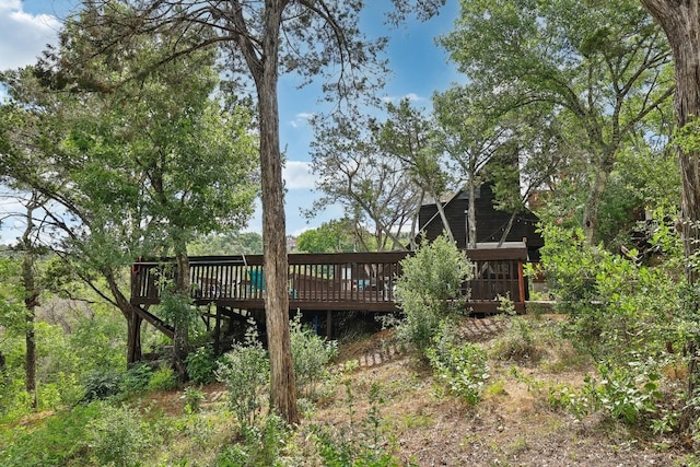 back of house with a wooden deck