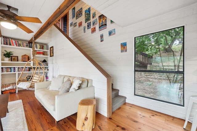 living room featuring hardwood / wood-style flooring and ceiling fan