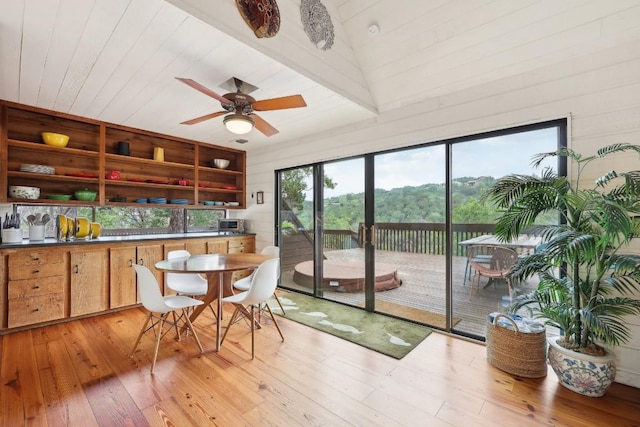 sunroom featuring wooden ceiling and ceiling fan