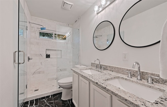 bathroom featuring vanity, toilet, and walk in shower