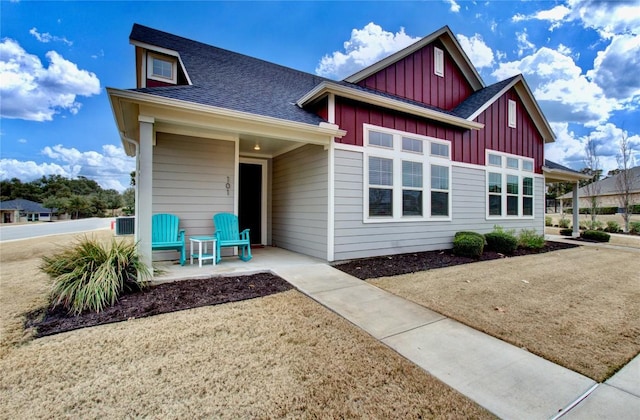321 Dancing Oak Ln Unit 101, San Marcos, TX 78666 - view of front of property featuring board and batten siding and roof with shingles