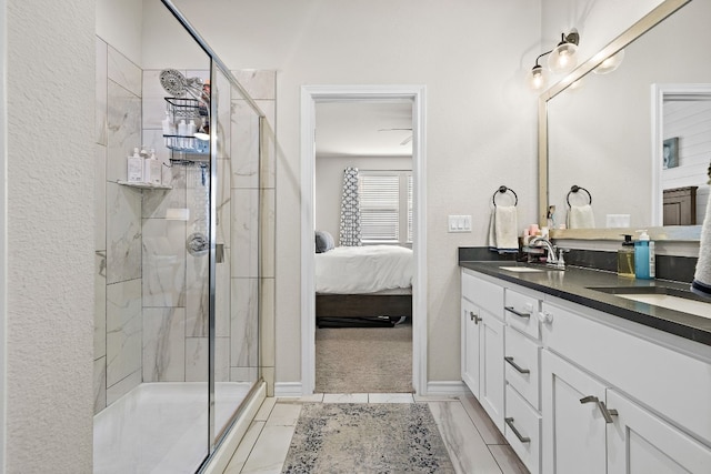 bathroom featuring vanity and a shower with door