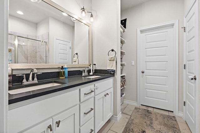 bathroom featuring vanity and a shower with door