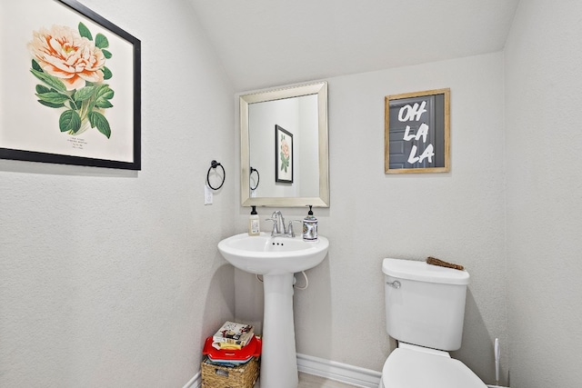 bathroom featuring sink and toilet