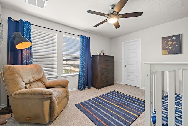 bedroom featuring light carpet and ceiling fan