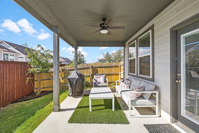 view of patio with grilling area, outdoor lounge area, and ceiling fan