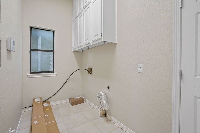 139 Jackrabbit Run, Round Rock, TX 78664 - laundry room featuring cabinet space, washer hookup, baseboards, tile patterned flooring, and electric dryer hookup
