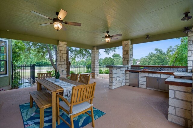 139 Jackrabbit Run, Round Rock, TX 78664 - view of patio / terrace with an outdoor kitchen, ceiling fan, outdoor dining area, and a sink