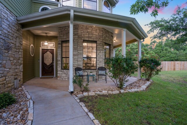 139 Jackrabbit Run, Round Rock, TX 78664 - view of exterior entry with stone siding and covered porch