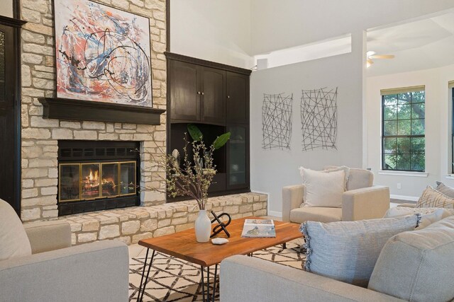 139 Jackrabbit Run, Round Rock, TX 78664 - living area with baseboards, a fireplace, ceiling fan, and wood finished floors