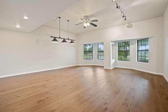 139 Jackrabbit Run, Round Rock, TX 78664 - unfurnished room with a ceiling fan, wood-type flooring, baseboards, recessed lighting, and track lighting