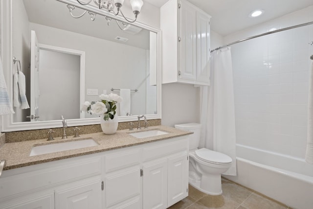 full bathroom featuring shower / bath combo with shower curtain, tile patterned floors, toilet, and vanity