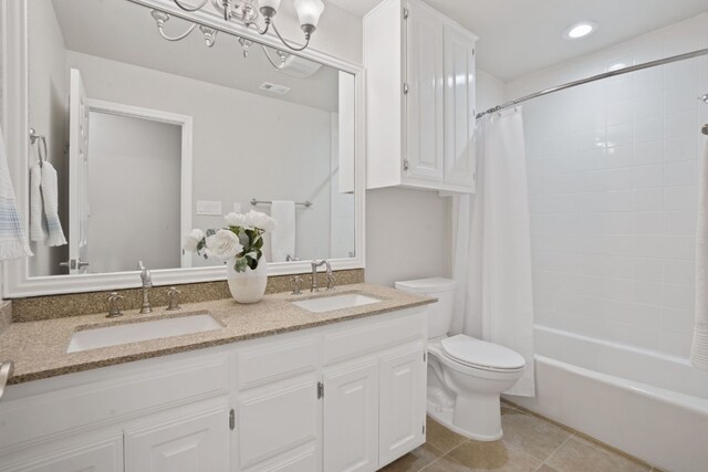139 Jackrabbit Run, Round Rock, TX 78664 - bathroom featuring double vanity, toilet, tile patterned flooring, shower / tub combo with curtain, and recessed lighting