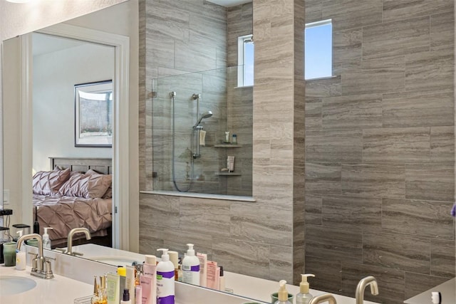 bathroom featuring vanity and a tile shower