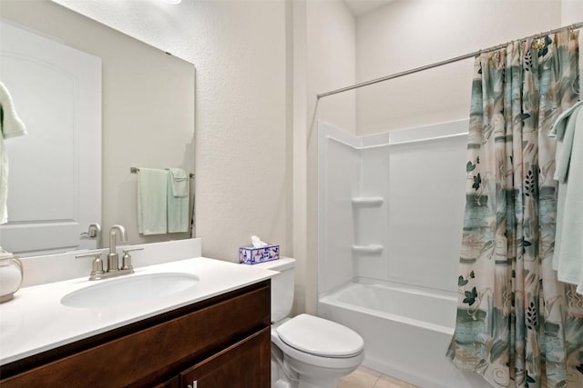 full bathroom featuring shower / tub combo with curtain, vanity, tile patterned floors, and toilet