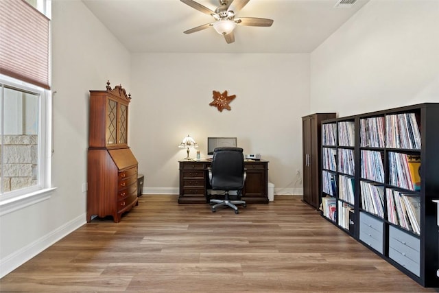 office area with ceiling fan and wood-type flooring