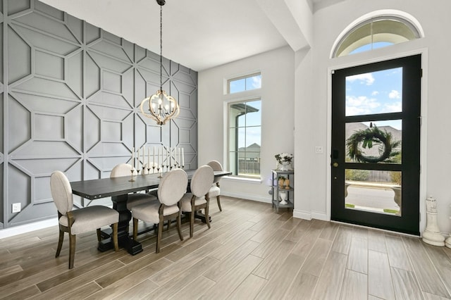 dining space featuring a chandelier