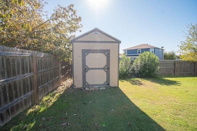 view of outbuilding featuring a lawn