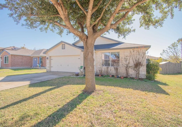 single story home featuring a garage and a front yard