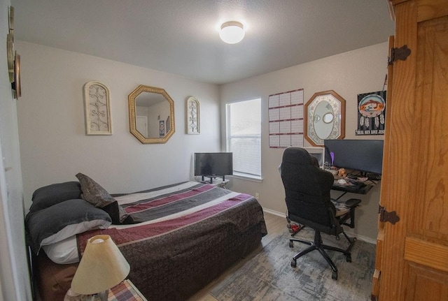 bedroom with hardwood / wood-style floors